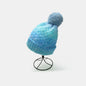 Gradient Knit Hat with Pompom - Stylish and cozy winter accessory in shades of blue with a fuzzy pom-pom.