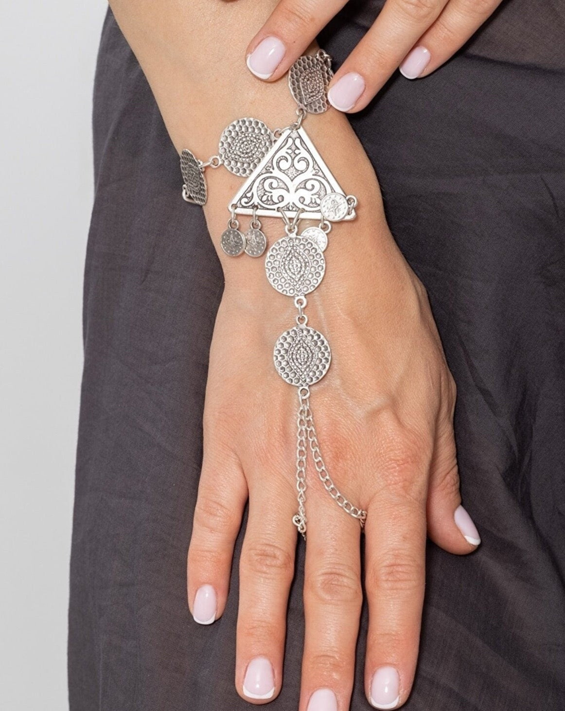 Elegant Filigree Slave Bracelet - Intricate silver-toned metal bracelet adorned with ornate filigree design, creating a stunning statement piece for the wrist.